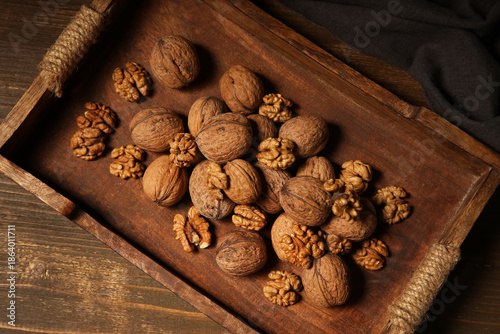 Tray with tasty walnuts on ...