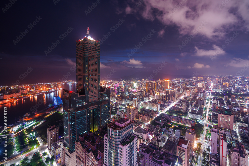 Obraz premium Aerial view of Kaohsiung 85 Sky Tower and Kaohsiung Harbor at sunset, Taiwan cityscape.