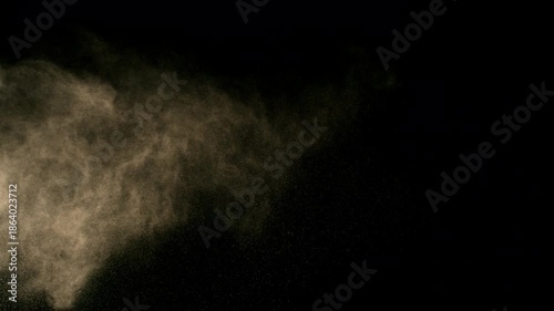 Super Slow Motion Shot of Flying Sand Powder , Isolated on Black Background , Filmed on High Speed Cinematic Camera at 1000 FPS
