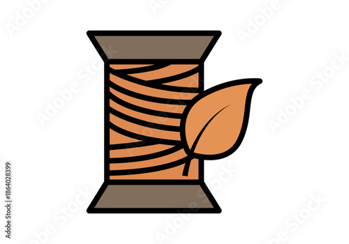Carrete de hilo marrón con una hoja para representar materiales textiles orgánicos y sostenibles