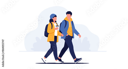 Young stylish couple walking together while holding a cup of takeaway coffee and wearing casual autumn clothing outdoors.