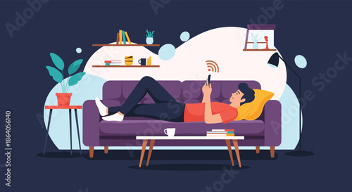 Young man relaxing on a purple sofa in a cozy living room while using his smartphone to browse the internet over wifi.