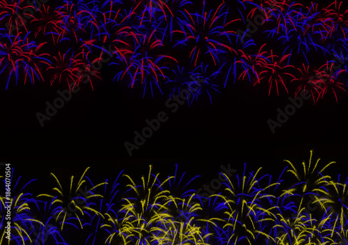Vibrant fireworks display illuminating the night sky with red blue and yellow colors creating a festive atmosphere perfect for celebrations and special occasions.