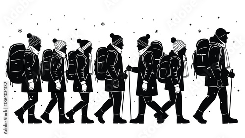 Group of hikers walking in snowy weather with backpacks