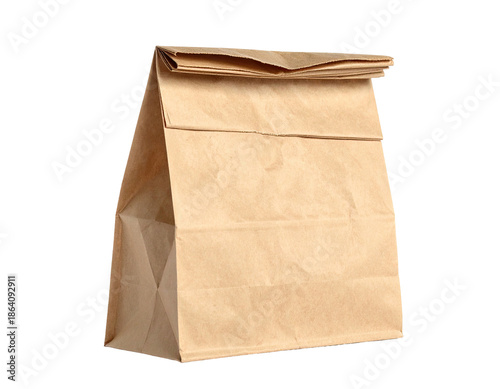 A close-up shot of a crumpled brown paper lunch bag, isolated against a transparent backdrop