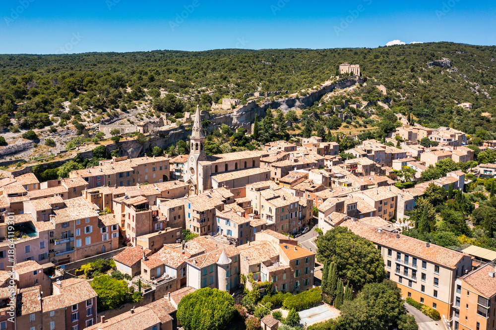 Fototapeta premium Panoramic view of village Saint Saturnin les Apt in Luberon regional natural park, Provence, France. View of the small village of Saint-Saturnin-les-Apt, Vaucluse, Provence, France.