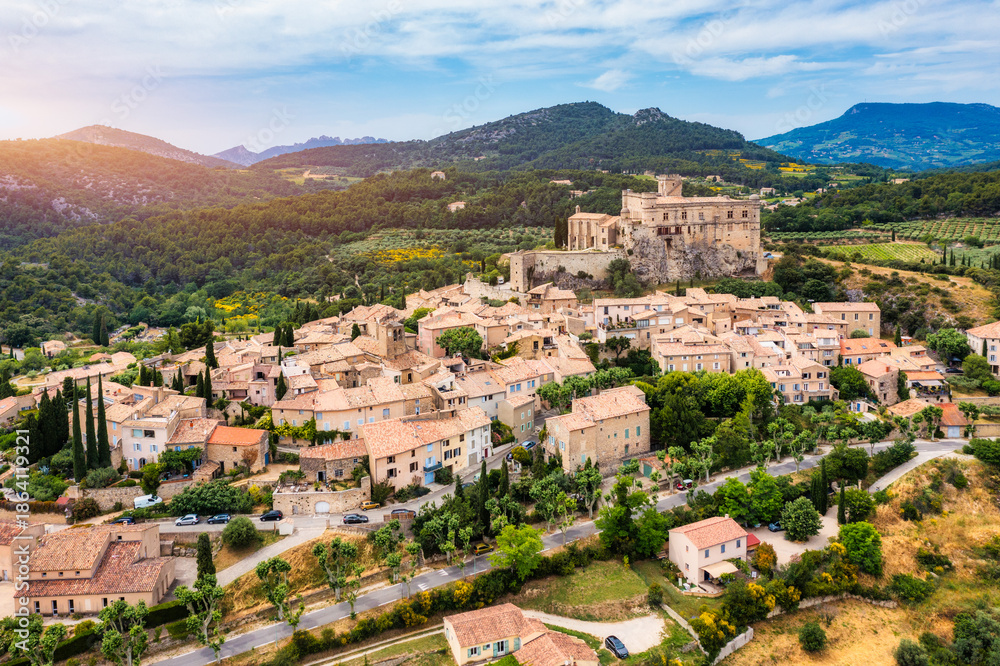 Fototapeta premium The beautiful medieval town of Le Barroux, Vaucluse, Provence, France. Aerial view of Le Barroux village with its castle, Provence, France. Perched village of Barroux and its fortified castle, France.