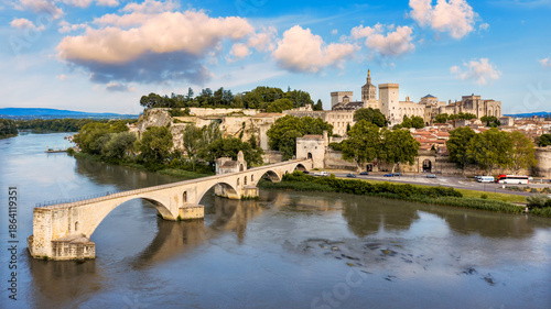 Beautiful view of Avignon with famous bridge Saint-Benezet, medieval architecture along the Rhone River in Avignon, France. The Pont Saint Benezet and the Papal palace in Avignon, South France.