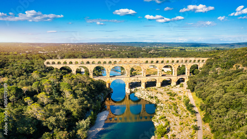 Exploring the majestic Pont du Gard aqueduct in France, discover the stunning architecture of the ancient Pont du Gard aqueduct in southern France. River Gard, Languedoc-Roussillon, France.