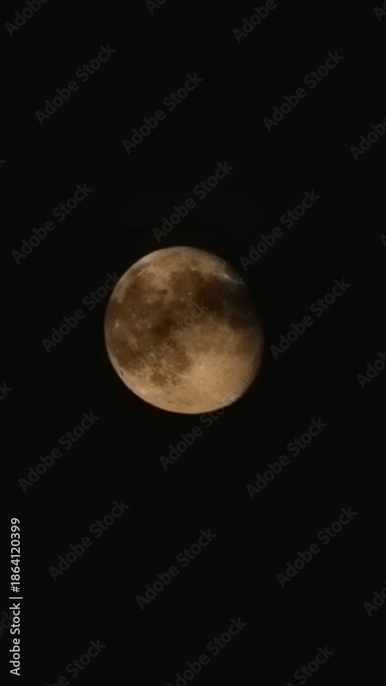 Obraz premium The brightest and largest object in our night sky, the Moon makes Earth a more livable planet by moderating our home planet's wobble on its axis, leading to a relatively stable climate. It also causes