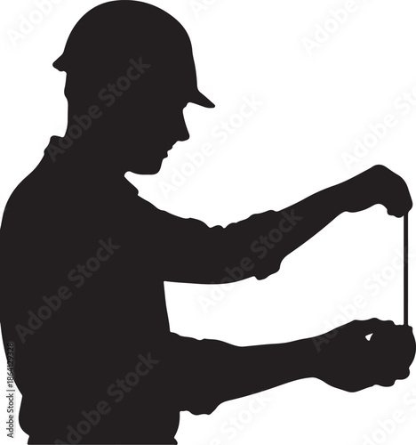 Worker measuring with tape