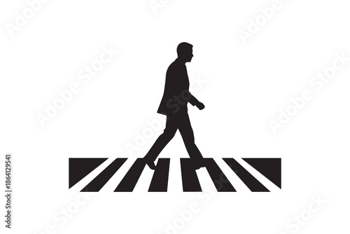 Man crossing the street on a pedestrian walkway silhouette