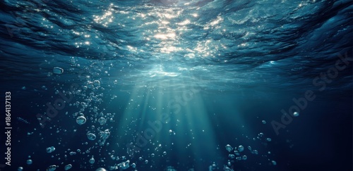 Sunbeams through deep, watery depths