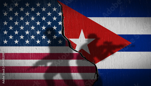 Foto National flags of USA and Cuba on a cracked stone wall with soldier silhouettes