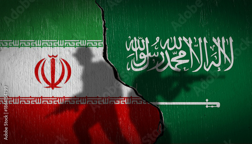 Photography National flags of Saudi Arabia and Iran on a cracked wall with soldier silhouettes