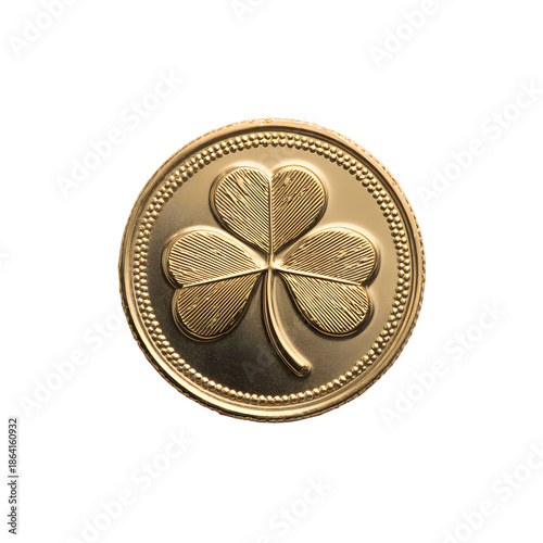 A golden coin featuring a detailed four leaf clover design on a black background