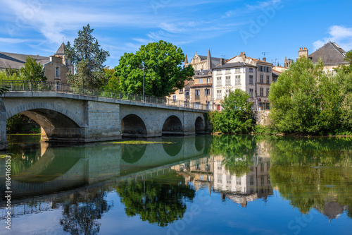 Stone Bridge Over Calm Clain River in Poitiers with Historic Reflections