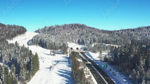 Aerial view of Zagreb-Rijeka highway going through the snow covered landscape in Gorski kotar, Croatia