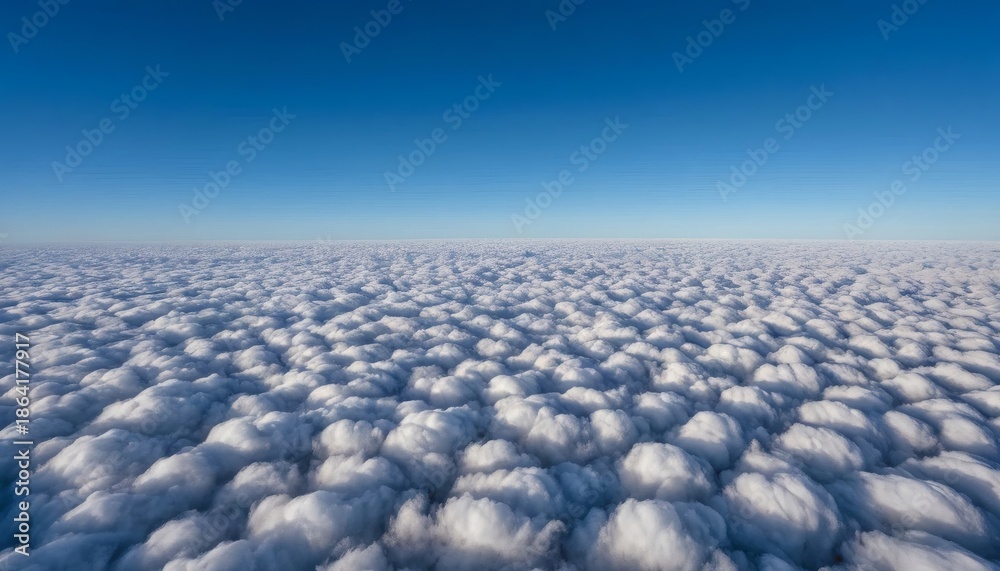 Fototapeta premium Breathtaking view of fluffy white clouds under clear blue sky