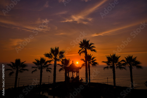 serene sunset at the Parque Chino (Chinese Park) in Miraflores, Lima. The park, inaugurated in 2022 to celebrate the bicentennial of Peru's independence and the long-standing friendship between Peru a