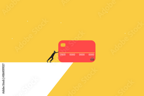 Financial struggle and the heavy burden of debt management in today's economy. Businessman pushing a giant red credit card toward a cliff