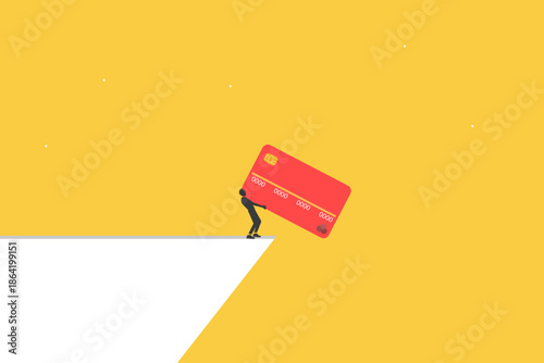 Financial struggle and the heavy burden of debt management in today's economy. Businessman escaping the debt trap and burden credit card toward a cliff