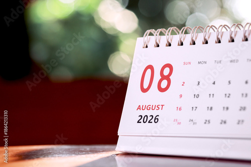 Calendar page of August 2026 on desk, with copy space. monthly planning concept, important schedules, meetings, and appointments.