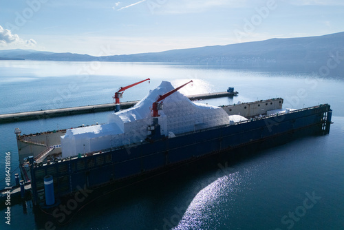 Fotografija Aerial view of a luxury yacht refit, repair, service and maintenance in a floating dock at a marina