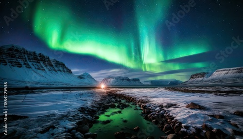 Spectacular Aurora Borealis Display Over Snowy Arctic Landscape.