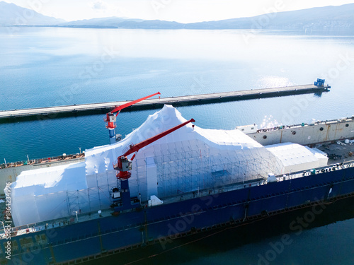 Fotografija Aerial view of a luxury yacht refit, repair, service and maintenance in a floating dock at a marina