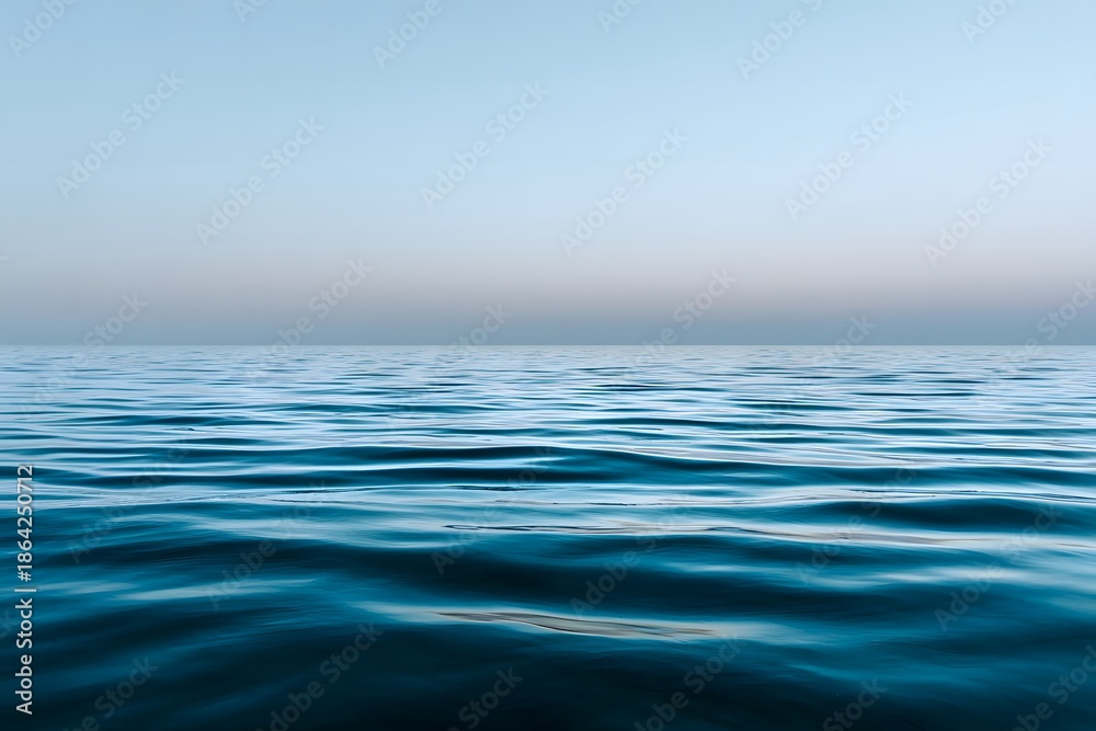 Obraz premium Serene water surface at blue hour, reflecting soft ripples and tranquil hues, creating a peaceful ambiance with copy space for design and creative projects