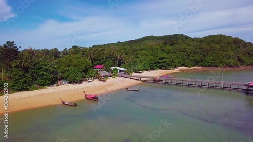 Aerial drone shot pan backwards revealing Ko Por tropical island in Thailand