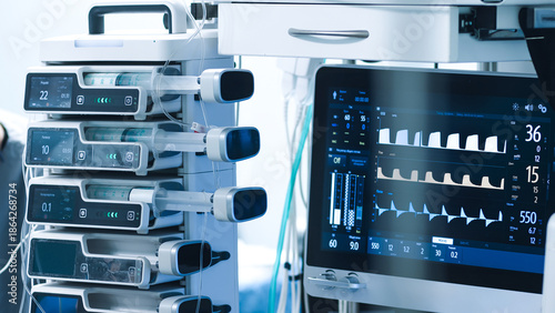 Foto Advanced medical equipment in a modern operating room, featuring monitors and in