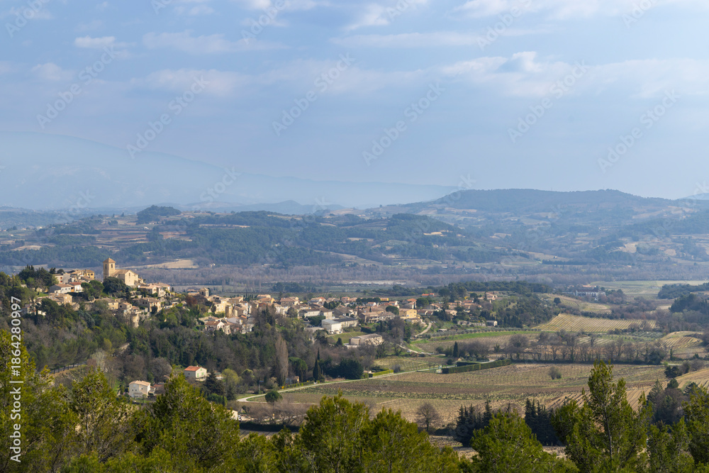 Obraz premium Vinsobres village architecture establishing tranquil rural French landscape