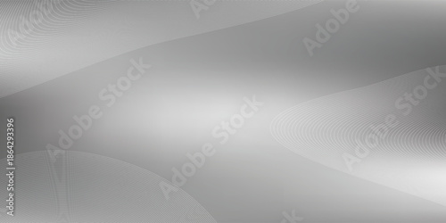 Abstract metallic background with subtle reflections and a smooth gradient of light and shadow.