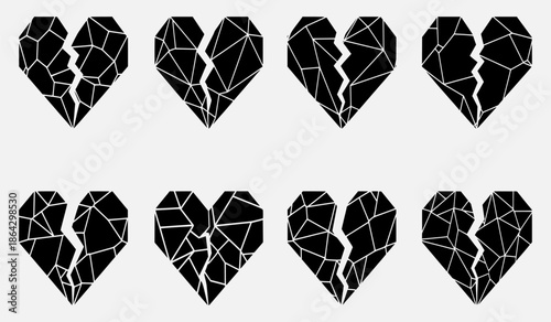 A collection of cracked and broken hearts in a grid pattern on a plain white background