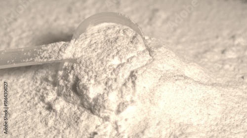 super slow motion Highdefinition cinematic portrayal of powder particles dispersing as supplement scoop breaks