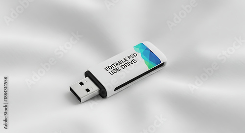 Close up of a white usb drive with editable psd text and blue and green design on a white background