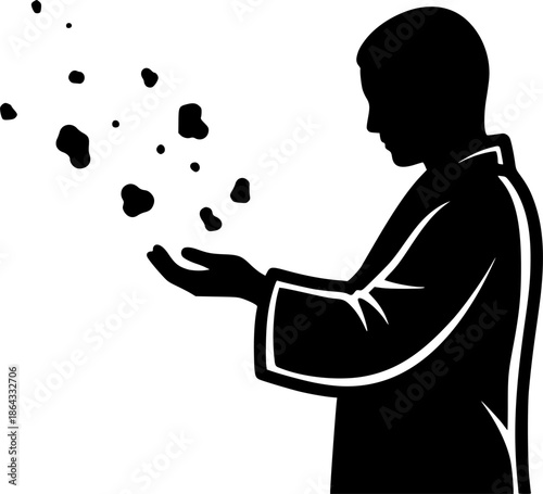 Silhouette of a person dispersing particles in a solemn, zen ill
