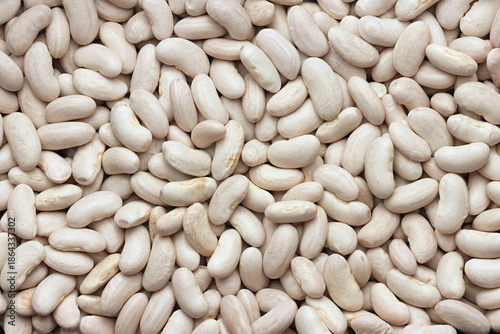 Dry Cannellini Beans ( white kidney beans ) close up in pile on white background