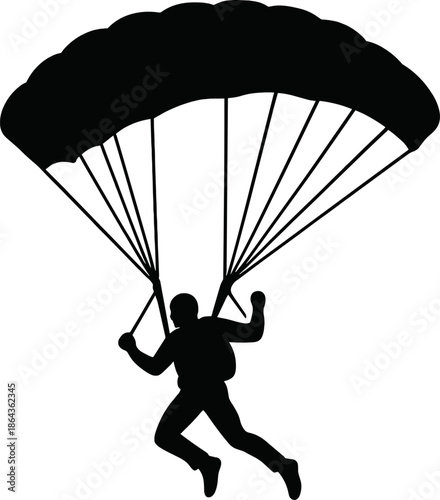 Silhouette of parachutist in descent with open parachute