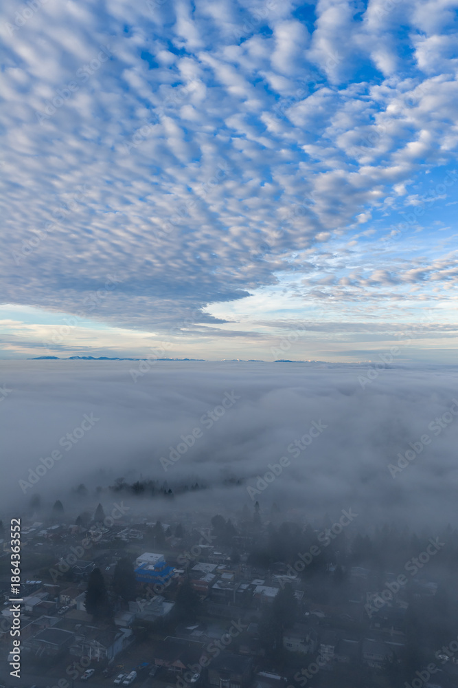 Obraz premium Aerial View Over Cloud Layer With Mountain Horizon And Beautiful Blue Sky At Dawn Today