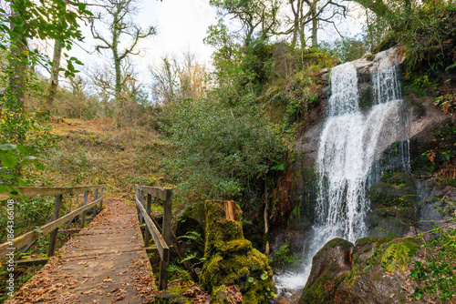 Cascata da Laja Waterfall and Wooden Bridge. Peneda-Geres National Park in Portugal