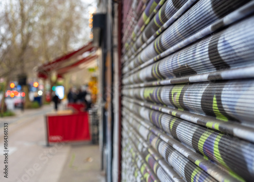Closed Shop Shutter on Blurred City Street of London