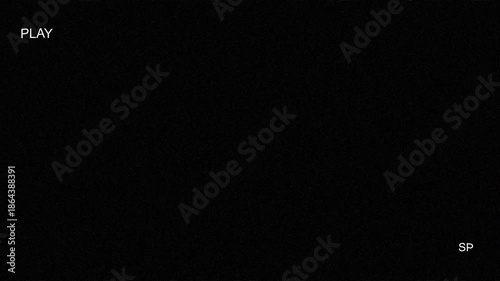 Retro visual of tape playing vhs with a worn out play vhs indicator, enhanced by scanlines and old school VHS distortion on a black screen.