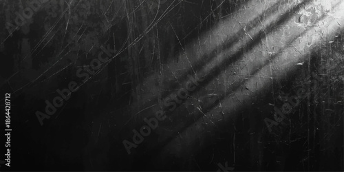 Abstract dark grunge background with a vintage black chalkboard texture on an old dirty wall surface providing a blank gray backdrop for design copy space