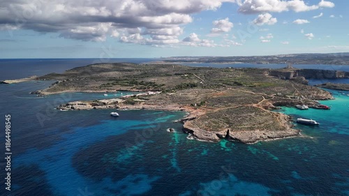 A view of Comino Island from a great height, encompassing the entire island and the incredible color of the water