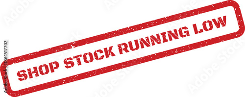 Rectangular red rubber stamp with grunge effect displaying shop stock running low for urgent inventory alerts