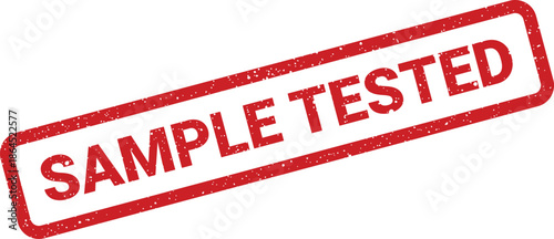 Red rectangular rubber stamp featuring SAMPLE TESTED text with grunge texture, signifying completion of an examination procedure or quality check