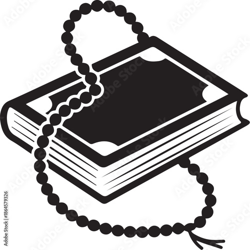 Black and white book with a beaded tassel hanging from it